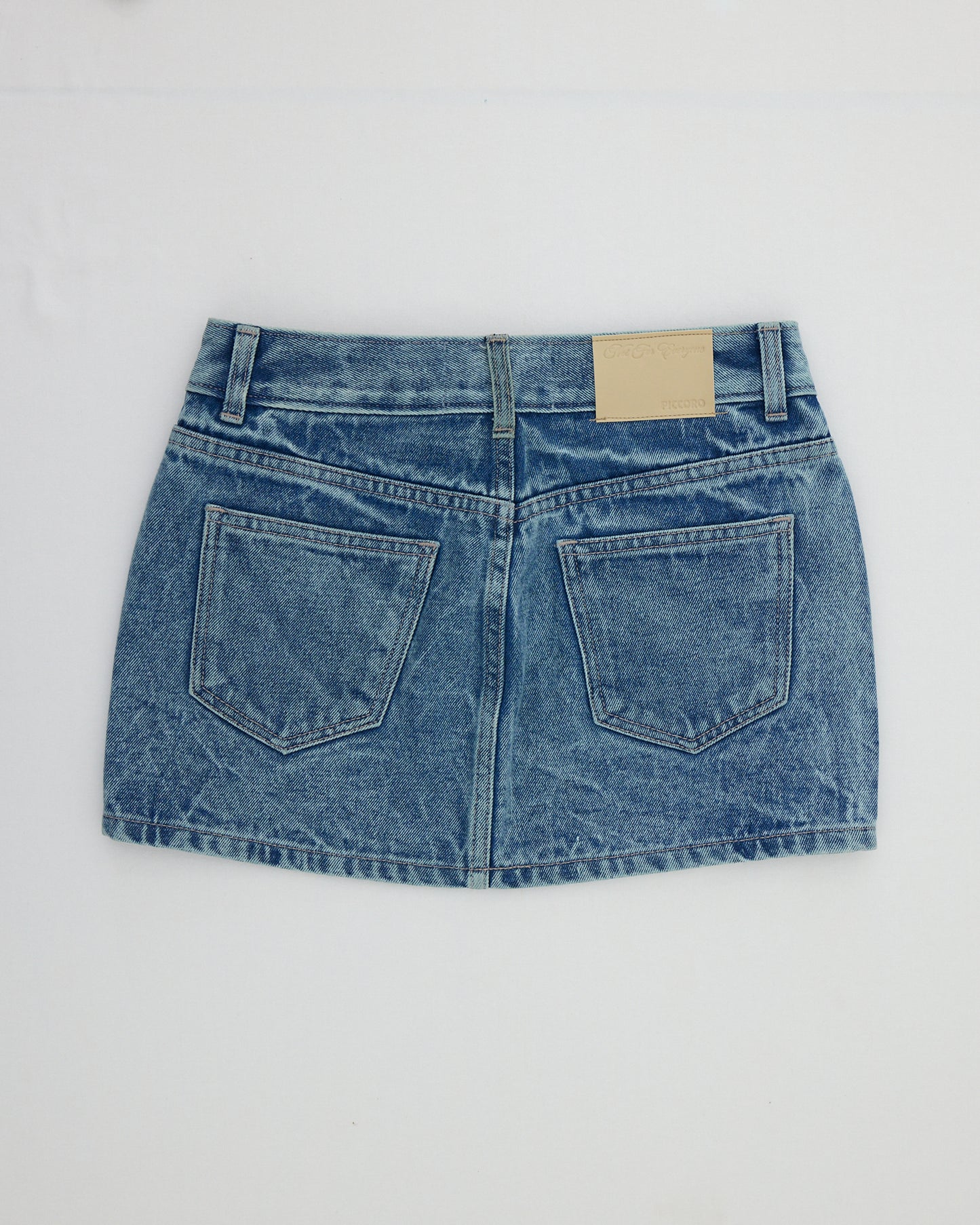NOT FOR EVERYONE x PICCORO - Eyelet denim mini skirt