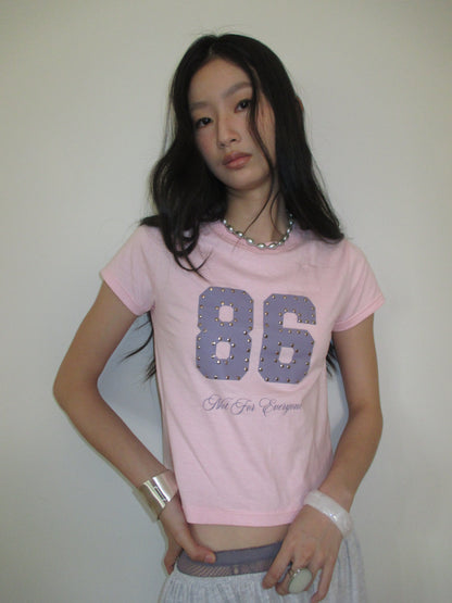 Not for everyone - 86 studded baby tee